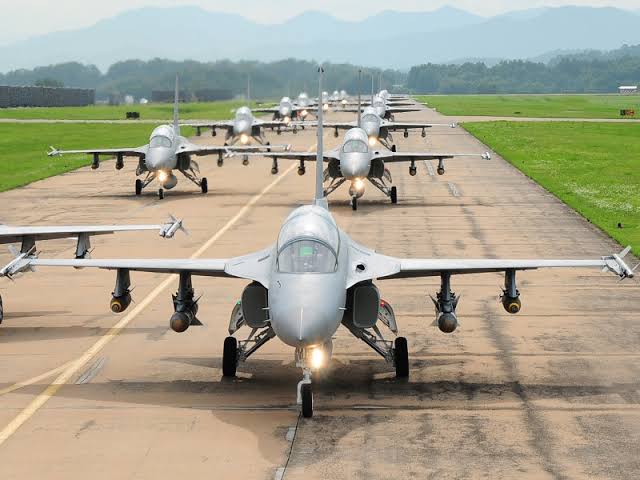 Nigerian Air Force fighter jets taxiing in formation on the runway